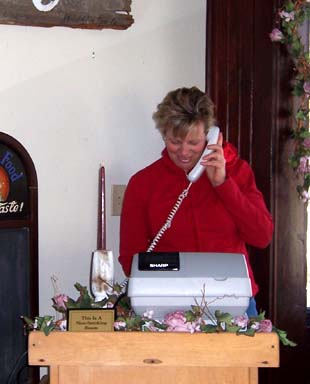 Sandy Gerber answers the phone at Buzby's Cafe in Chatsworth